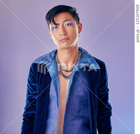 Asian man, makeup and punk fashion for portrait in studio with cyberpunk, creative or aesthetic face. Futuristic model, metal jewellery or clothes with art, cosmetic or beauty by lavender background 125107608
