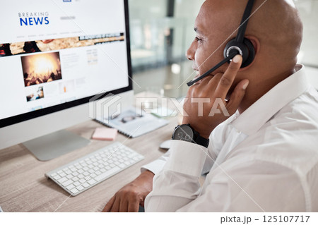 Call center, man and computer with online news advice for customer service communication. Hotline, operator and crm or contact us telemarketing agent talking on a helpline headset in contact center Call center, man and computer with online news advice for customer service communication. Hotline, operator and crm or contact us telemarketing agent talking on a helpline headset in contact center 125107717