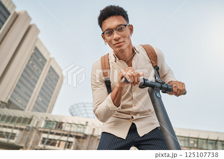 Scooter, city and portrait of a student man for travel and transportation with carbon footprint, eco friendly and urban lifestyle. Young gen z college or university person with an electric scooter Scooter, city and portrait of a student man for travel and transportation with carbon footprint, eco friendly and urban lifestyle. Young gen z college or university person with an electric scooter 125107738
