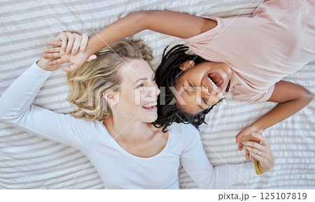 Mother, girl and bed fun after adoption or foster with love and care in a bedroom with happiness. Family care, funny and happy time of a mama and child together with a smile, gratitude and laughing Mother, girl and bed fun after adoption or foster with love and care in a bedroom with happiness. Family care, funny and happy time of a mama and child together with a smile, gratitude and laughing 125107819