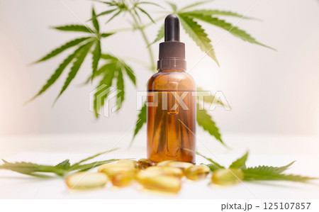 Cannabis, marijuana and product with oil of cbd for alternative medicine, natural skincare or healthcare supplement. Beauty, luxury and wellness with legal pills and weed plant for anxiety and stress 125107857