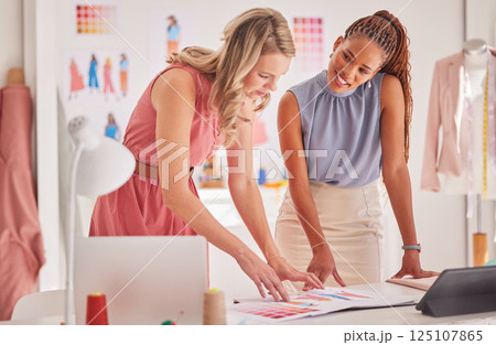 Fashion, design and team working, planning and creative thinking for range creation in their office, happy and content. Diversity, partnership and teamwork by women discuss, choose and fabric color 125107865