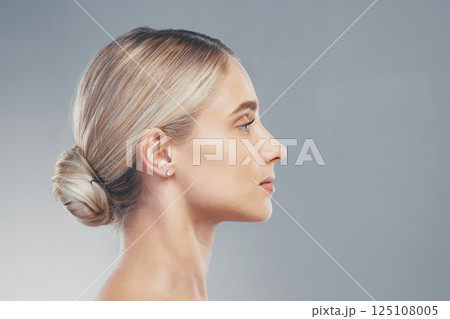 Skincare, profile and side face of a woman for dermatology, wellness and natural beauty against a grey mockup studio background. Advertising, marketing and model with cosmetic health and space 125108005