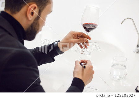 Wine degustation. Sommelier Perfecting Wine Tasting Skills in Professional Development Courses, Close up Wine degustation. Sommelier Perfecting Wine Tasting Skills in Professional Development Courses, Close up 125108027