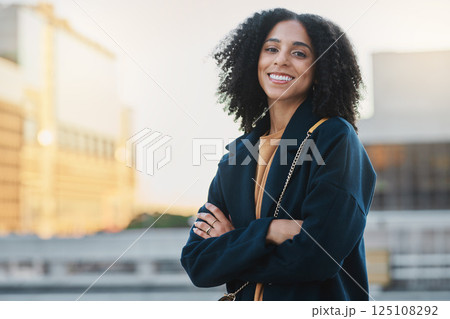 Black woman, city and smile portrait of a person by and urban building feeling relax and happy. Travel, freedom and happiness of a young female outdoor with a bag ready for traveling or work Black woman, city and smile portrait of a person by and urban building feeling relax and happy. Travel, freedom and happiness of a young female outdoor with a bag ready for traveling or work 125108292