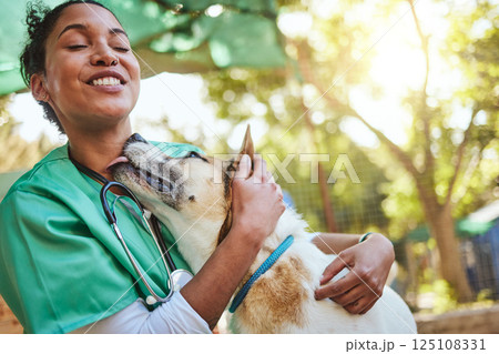 Vet, happy and nurse with a dog in nature doing medical healthcare checkup and charity work for homeless animals. Smile, doctor or veterinarian loves nursing, working or helping dogs, puppy and pets 125108331