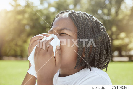 Covid, health and black kid blowing nose at park, nature or outdoors. Wellness, healthcare and sick girl child with tissue to wipe nose for virus, infection or cold, flu or covid 19, fever or allergy Covid, health and black kid blowing nose at park, nature or outdoors. Wellness, healthcare and sick girl child with tissue to wipe nose for virus, infection or cold, flu or covid 19, fever or allergy 125108363