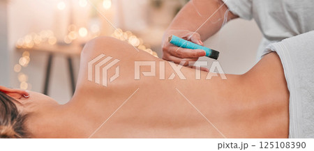 Spa, heat acupuncture and woman relaxing for a back massage using moxibustion or alternative medicine. Healing, acupuncturist and massage therapy with physical therapy on patient with sen treatment 125108390