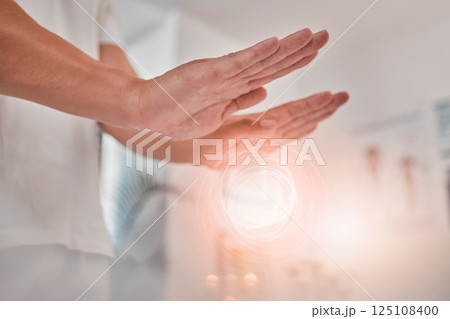 Spa, energy and hands of reiki healer doing holistic aura, soul or chakra healing for healthcare, wellness or spiritual balance. Spirituality power, alternative medicine light or palm of mystical man 125108400