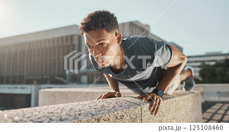 Exercise, black man and push ups outdoor at workout, fitness and focus for wellness, health and training. Motivation, young male and athlete in city, healthy and practice in sportswear and strong 125108460