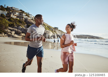 Couple, fitness and running with smile at the beach, exercise and cardio, happiness and active lifestyle. Young, happy people, runner and health, body training and motivation workout outdoor at ocean Couple, fitness and running with smile at the beach, exercise and cardio, happiness and active lifestyle. Young, happy people, runner and health, body training and motivation workout outdoor at ocean 125108465