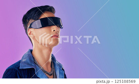 Beauty, fashion and man with cyberpunk glasses in studio with blue and purple background. Creative, cosmetics and young male model with visor for futuristic style, techno and designer clothing Beauty, fashion and man with cyberpunk glasses in studio with blue and purple background. Creative, cosmetics and young male model with visor for futuristic style, techno and designer clothing 125108569