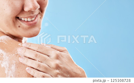 Skincare, shower and soap with shoulder of woman with mockup for beauty, luxury and spa. Wellness, hygiene and cleaning with girl model and foam for self care, grooming and routine in blue background 125108728