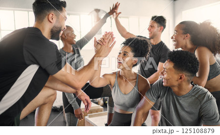 Fitness, high five and group at the gym in celebration of fitness goal, achievement and success. Sports, team building and motivation of athletic friends after intense training, workout or exercise. 125108879