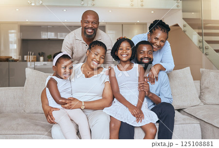 Happy black family, portrait smile and sofa relaxing together for quality bonding or break at home. Mother, father and grandparents with kids smiling in relax for family time on living room couch Happy black family, portrait smile and sofa relaxing together for quality bonding or break at home. Mother, father and grandparents with kids smiling in relax for family time on living room couch 125108881