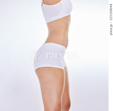 Underwear, body goals and woman in studio for fitness, diet or wellness fashion marketing, advertising or promotion space. Sexy woman or slimming sports model with cellulite health or fitness clothes Underwear, body goals and woman in studio for fitness, diet or wellness fashion marketing, advertising or promotion space. Sexy woman or slimming sports model with cellulite health or fitness clothes 125109048