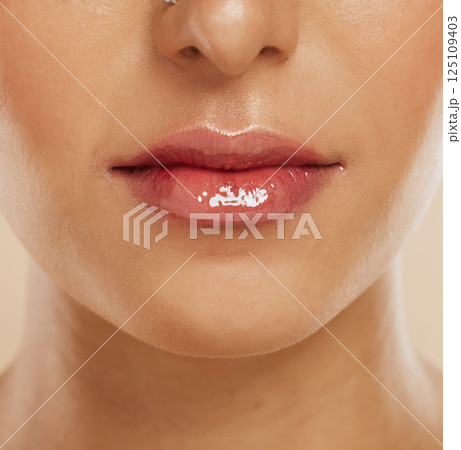 Lips, skincare and woman with lipstick for cosmetics, gloss and wellness for clear, smooth and glow skin. Natural beauty, healthy and girl or female with makeup for shiny mouth, fresh and collagen. 125109403