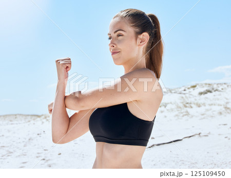 Woman, stretching arm and beach fitness for body health, wellness and happy training in nature in summer. Fitness female, warm up and morning workout with happiness, calm mindset and commitment Woman, stretching arm and beach fitness for body health, wellness and happy training in nature in summer. Fitness female, warm up and morning workout with happiness, calm mindset and commitment 125109450