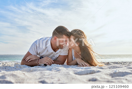Love, beach and couple laying in sand, happy woman with man on a summer holiday at ocean. Romance, nature and sun, a happy couple from Australia by the sea, sunset and romantic vacation time together Love, beach and couple laying in sand, happy woman with man on a summer holiday at ocean. Romance, nature and sun, a happy couple from Australia by the sea, sunset and romantic vacation time together 125109460