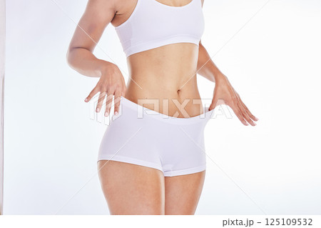 Beauty, weightloss and slim body of woman isolated on white background in studio for healthy lifestyle. Wellness, fitness and female model in white underwear for dieting, nutrition and body care 125109532