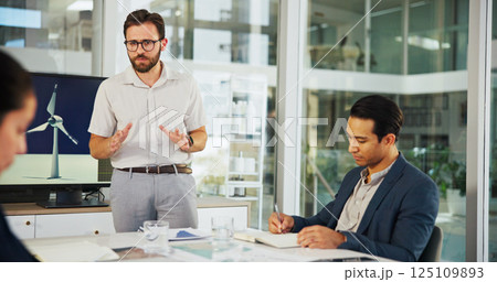Businessman, meeting or presentation with discussion for renewable or clean energy at conference. Man, employee or speaker talking to group with proposal for wind turbine or eco development at office Businessman, meeting or presentation with discussion for renewable or clean energy at conference. Man, employee or speaker talking to group with proposal for wind turbine or eco development at office 125109893
