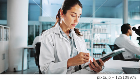 Scientist, woman and medical research with tablet at lab with writing, review and notes for pharma job. Person, gloves and equipment with application for vaccine development, trial and clinical study 125109978
