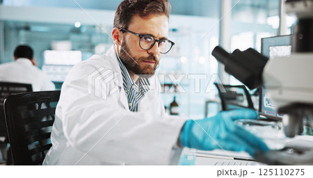 Scientist, man and medical research with microscope at lab with sample, review and glasses for pharma job. Person, gloves and equipment with process for vaccine innovation, trial and clinical study 125110275