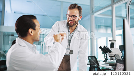 Teamwork, people or scientists fist bump for research breakthrough, clinical trial or DNA discovery. Success, celebrate or science goals in lab with chemistry results, medical test or medicine cure 125110521