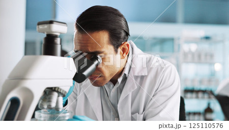 Microscope, research and science with man in laboratory for healthcare, medical or pharmaceutical innovation. DNA, sample and study with scientist in clinical trial for breakthrough or development 125110576