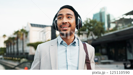Business, man and walking with headphones in city for morning commute, music playlist and streaming audio. Professional, person and smile outdoor for sound track, corporate podcast and work travel Business, man and walking with headphones in city for morning commute, music playlist and streaming audio. Professional, person and smile outdoor for sound track, corporate podcast and work travel 125110590