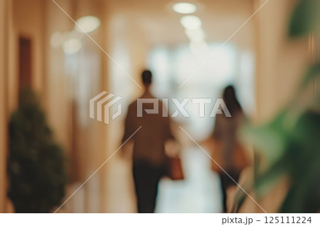 Blurred background people walking along corridor in office. mocha mousse coloured realistic photo Blurred background people walking along corridor in office. mocha mousse coloured realistic photo 125111224