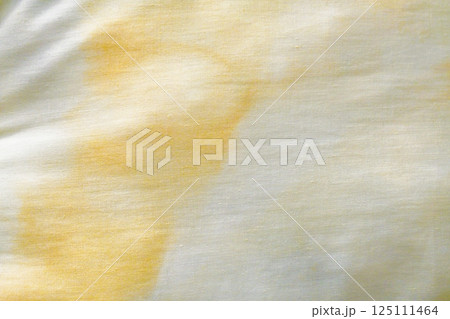 Dirty old pillow with yellow stains. Unclean mattress fabric clothes. 125111464