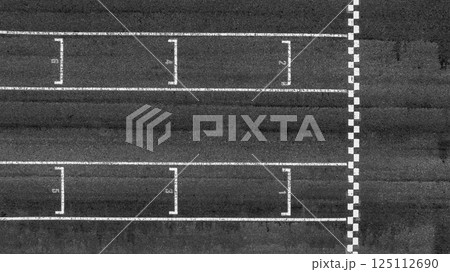 Start or finish line on car race, Start and finish line racing, Grid start race track, Top view textured and background grid start on the asphalt road race track abstract. Start or finish line on car race, Start and finish line racing, Grid start race track, Top view textured and background grid start on the asphalt road race track abstract. 125112690