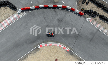 Aerial view go kart racer race curve circuit, Go kart at circuit curve, Top view race go kart track curve. 125112747