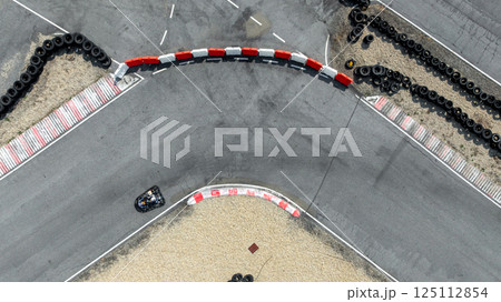 Aerial view go kart racer race curve circuit, Go kart at circuit curve, Top view race go kart track curve. 125112854