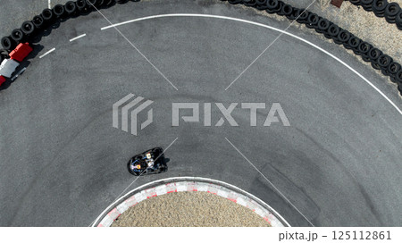 Aerial view go kart racer race curve circuit, Go kart at circuit curve, Top view race go kart track curve. 125112861