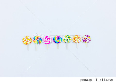 Sweet food lollipop on white background, Set of colorful lollipops isolated on white background, Colorful lollipops swirls, Spiral multicolor candy on white background, Top view Sweet food lollipop on white background, Set of colorful lollipops isolated on white background, Colorful lollipops swirls, Spiral multicolor candy on white background, Top view 125113856