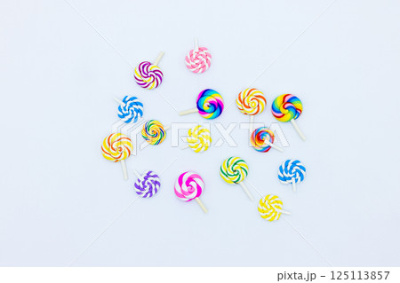 Sweet food lollipop on white background, Set of colorful lollipops isolated on white background, Colorful lollipops swirls, Spiral multicolor candy on white background, Top view Sweet food lollipop on white background, Set of colorful lollipops isolated on white background, Colorful lollipops swirls, Spiral multicolor candy on white background, Top view 125113857