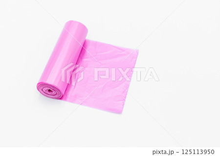 Roll of pink plastic garbage bags on white background, Pink color garbage bags roll,  Roll of pink plastic garbage bags on white background. 125113950