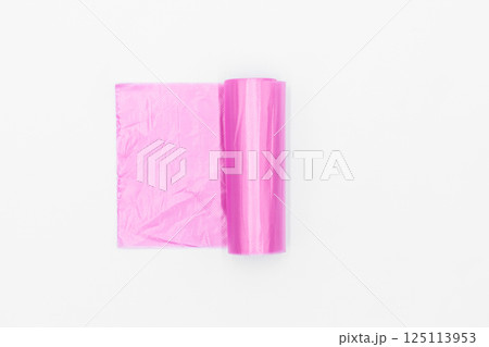 Roll of pink plastic garbage bags on white background, Pink color garbage bags roll, Roll of pink plastic garbage bags on white background. Roll of pink plastic garbage bags on white background, Pink color garbage bags roll, Roll of pink plastic garbage bags on white background. 125113953