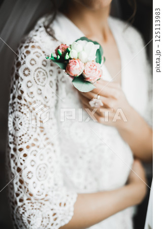 Perfect wedding couple holding luxury bouquet of flowers Perfect wedding couple holding luxury bouquet of flowers 125113983