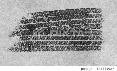 Top view tire marks on the asphalt road, Abstract texture and background black tire tracks on asphalt road, Tire marks on race track texture and background, Vehicle trace on road tire print texture of 125113987