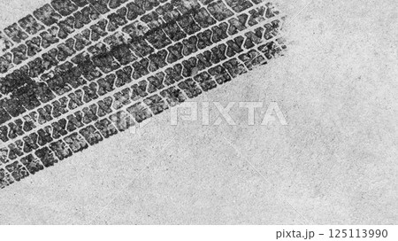 Black tire marks on road, Black rubber tire marks and tread marks, Tire trace track wheels texture and background, Auto tire tread grunge, Car wheel tyre tread track black tyre print, Top view. 125113990