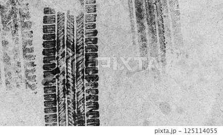 Black tire marks on road, Black rubber tire marks and tread marks, Tire trace track wheels texture and background, Auto tire tread grunge, Car wheel tyre tread track black tyre print, Top view. Black tire marks on road, Black rubber tire marks and tread marks, Tire trace track wheels texture and background, Auto tire tread grunge, Car wheel tyre tread track black tyre print, Top view. 125114055
