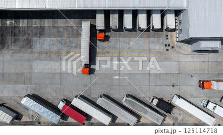 Aerial top view semi truck cargo trailer at logistic park warehouse goods, Distribution warehouse shipping supply chain, Business transportation logistic freight shipping cargo by semi truck cargo Aerial top view semi truck cargo trailer at logistic park warehouse goods, Distribution warehouse shipping supply chain, Business transportation logistic freight shipping cargo by semi truck cargo 125114718