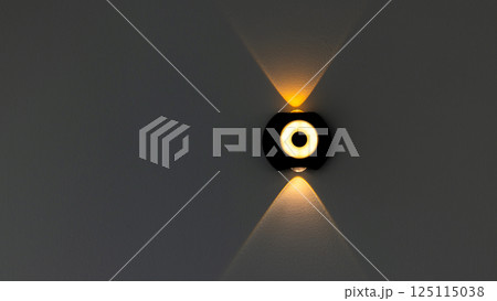 The illumination will go to the wall, Spotlight illuminating orange color warm light textured gray concrete wall, Spot light background, Wall with light shining texture and background. The illumination will go to the wall, Spotlight illuminating orange color warm light textured gray concrete wall, Spot light background, Wall with light shining texture and background. 125115038