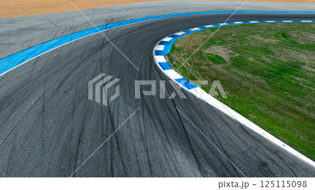 Asphalt race track curve with tire mark, Race track for auto racing with car tire skid mark, Car race track asphalt and curve track circuit, Empty curve racetrack car tire mark 125115098