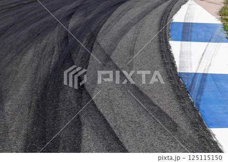 Car tire mark on race track, Abstract black car tire mark on race track, Abstract texture background car tire mark skid mark on asphalt circuit, Tire track on road race speed track circuit. Car tire mark on race track, Abstract black car tire mark on race track, Abstract texture background car tire mark skid mark on asphalt circuit, Tire track on road race speed track circuit. 125115150