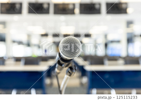 Microphone for press conference speaker report interview in press room, Microphone on stand in conference room, Public announcement event, Organization company meeting, live performance media. Microphone for press conference speaker report interview in press room, Microphone on stand in conference room, Public announcement event, Organization company meeting, live performance media. 125115233