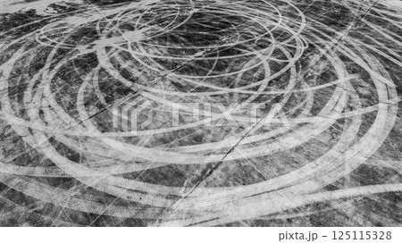 Car tire marks on asphalt car race track circuit, Car tire mark on speed track texture and background, Abstract car tire mark on race track, Top view car tire track. 125115328
